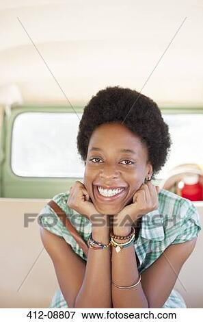 Portrait of smiling woman in back seat of camper van View Large Photo Image Stock Photo - Portrait of smiling woman in back seat of camper van. Fotosearch