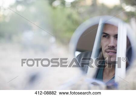 Reflection of man's face in side view mirror View Large Photo Image Stock Image - Reflection of man's face in side view mirror. Fotosearch