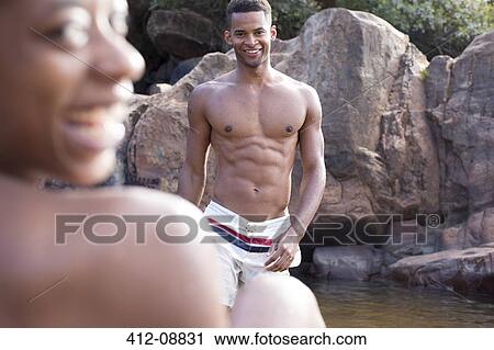 Smiling man at riverside View Large Photo Image Stock Image - Smiling man at riverside. Fotosearch