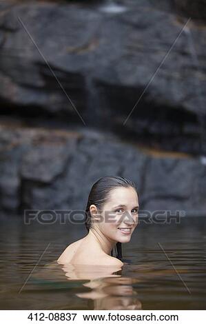 Stock Photo - Woman swimming in pool. Fotosearch