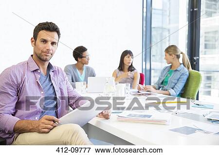 Stock Photo - Business people in meeting. Fotosearch