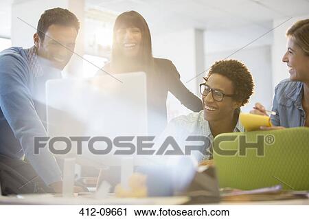 Business people laughing in office View Large Photo Image Stock Image - Business people laughing in office. Fotosearch