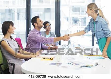 Business people shaking hands in meeting View Large Photo Image Stock Photo - Business people shaking hands in meeting. Fotosearch