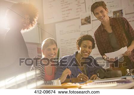 Business people smiling in office View Large Photo Image Picture - Business people smiling in office. Fotosearch