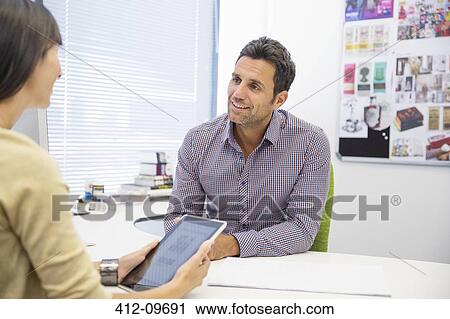 Business people talking in office View Large Photo Image Stock Image - Business people talking in office. Fotosearch