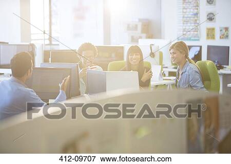 Business people talking in office View Large Photo Image Stock Photo - Business people talking in office. Fotosearch