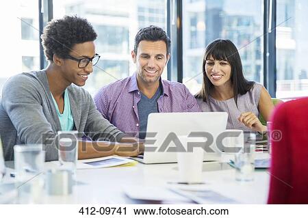 Business people using laptop in meeting View Large Photo Image Stock Image - Business people using laptop in meeting. Fotosearch