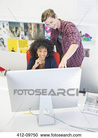 Business people working at computer in office View Large Photo Image Stock Image - Business people working at computer in office. Fotosearch