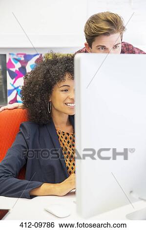 Business people working at computer in office View Large Photo Image Stock Photograph - Business people working at computer in office. Fotosearch