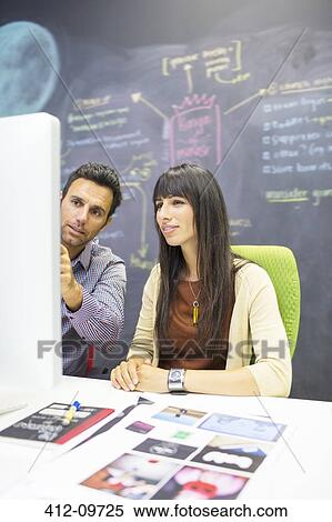 Business people working at computer in office View Large Photo Image Stock Photography - Business people working at computer in office. Fotosearch