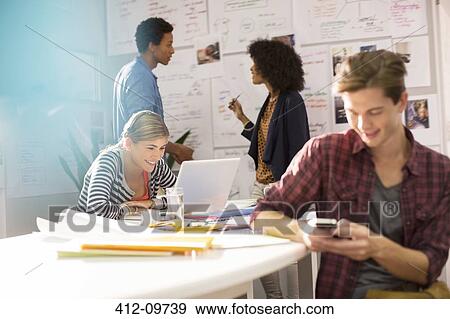 Business people working in office View Large Photo Image Stock Photo - Business people working in office. Fotosearch
