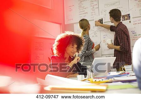 Business people working in office View Large Photo Image Stock Photo - Business people working in office. Fotosearch