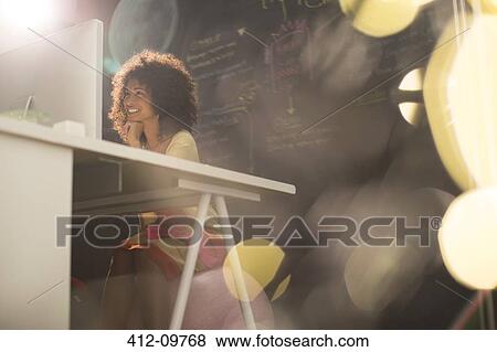 Businesswoman at desk in office View Large Photo Image Stock Photo - Businesswoman at desk in office. Fotosearch