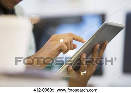 Close up of businessman using digital tablet View Large Photo Image Stock Photography - Close up of businessman using digital tablet. Fotosearch