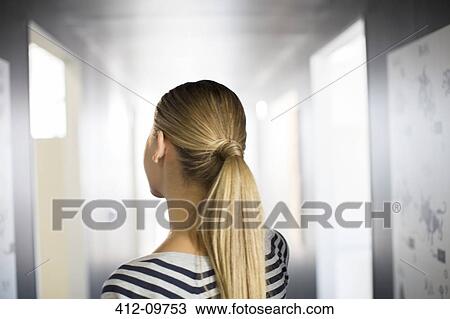 Stock Image - Close up of woman's blonde ponytail. Fotosearch