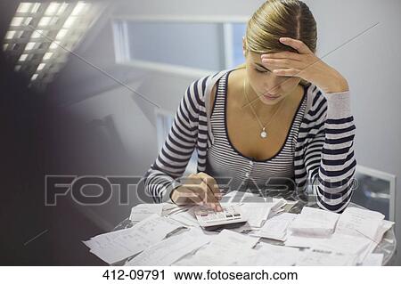 Frustrated woman paying bills View Large Photo Image Stock Image - Frustrated woman paying bills. Fotosearch