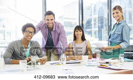 Portrait of smiling business people in conference room View Large Photo Image Stock Image - Portrait of smiling business people in conference room. Fotosearch