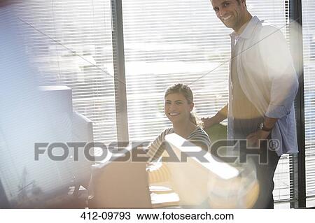 Portrait of smiling business people in office View Large Photo Image Stock Image - Portrait of smiling business people in office. Fotosearch