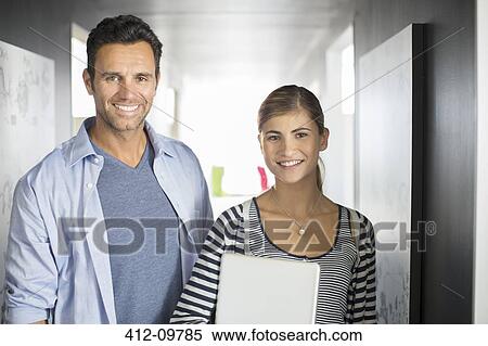 Portrait of smiling business people in office View Large Photo Image Stock Photography - Portrait of smiling business people in office. Fotosearch