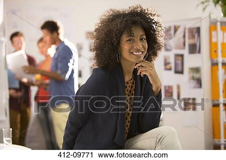 Portrait of smiling businesswoman in office View Large Photo Image Stock Image - Portrait of smiling businesswoman in office. Fotosearch