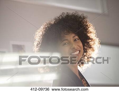 Stock Photograph - Portrait of smiling businesswoman. Fotosearch