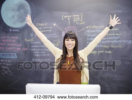 Portrait of smiling businesswoman with arms outstretched View Large Photo Image Picture - Portrait of smiling businesswoman with arms outstretched. Fotosearch