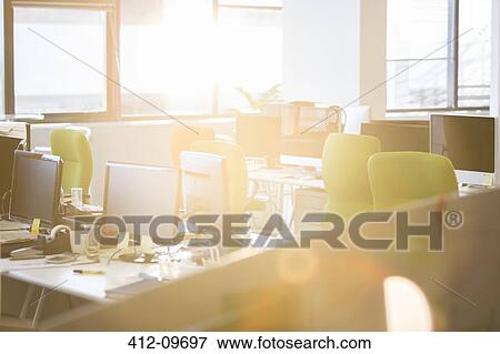 Sunlight streaming into empty office View Large Photo Image Stock Photo - Sunlight streaming into empty office. Fotosearch