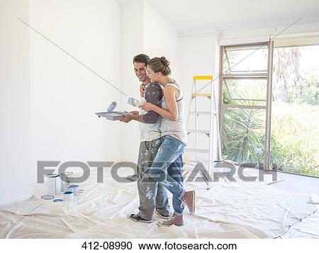 Couple painting walls View Large Photo Image Stock Image - Couple painting walls. Fotosearch