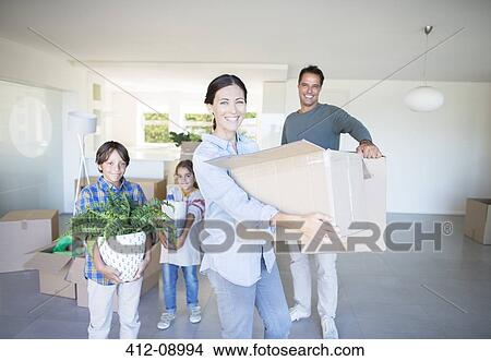 Family moving into new house View Large Photo Image Picture - Family moving into new house. Fotosearch