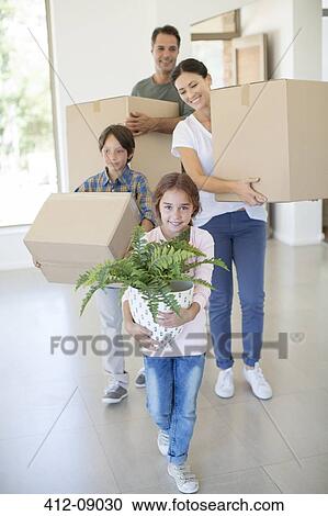 Stock Image - Family moving into new house. Fotosearch