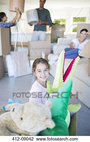 Girl playing with stuffed animals in new house View Large Photo Image Stock Image - Girl playing with stuffed animals in new house. Fotosearch