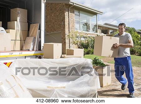 Man carrying cardboard box to moving van in driveway View Large Photo Image Stock Image - Man carrying cardboard box to moving van in driveway. Fotosearch