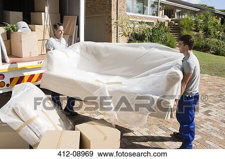 Movers carrying sofa from moving van in driveway View Large Photo Image Stock Photo - Movers carrying sofa from moving van in driveway. Fotosearch