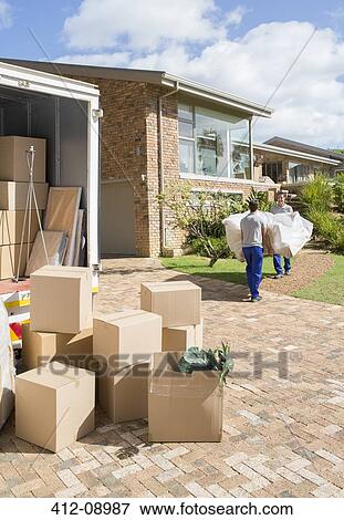 Movers carrying sofa from moving van to new house View Large Photo Image Stock Photo - Movers carrying sofa from moving van to new house. Fotosearch