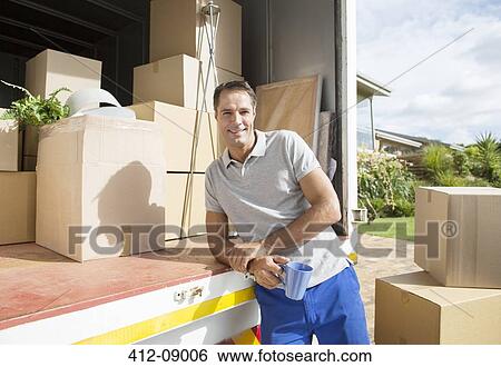 Portrait of man leaning on back of moving van View Large Photo Image Stock Photograph - Portrait of man leaning on back of moving van. Fotosearch