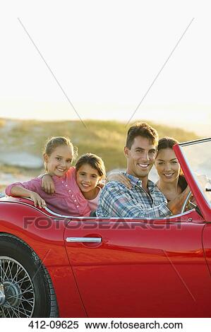 Family driving together in convertible View Large Photo Image Stock Photography - Family driving together in convertible. Fotosearch