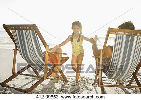 Family relaxing on beach View Large Photo Image Stock Image - Family relaxing on beach. Fotosearch