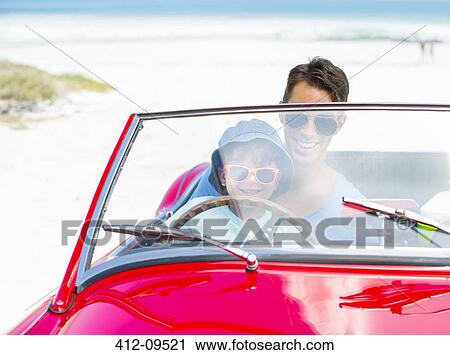 Father and son driving convertible on beach View Large Photo Image Stock Image - Father and son driving convertible on beach. Fotosearch