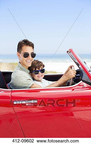 Father and son driving convertible on beach View Large Photo Image Stock Image - Father and son driving convertible on beach. Fotosearch