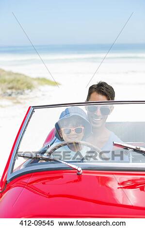 Father and son driving convertible on beach View Large Photo Image Stock Photography - Father and son driving convertible on beach. Fotosearch