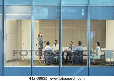 Business people talking in conference room View Large Photo Image Stock Photography - Business people talking in conference room. Fotosearch