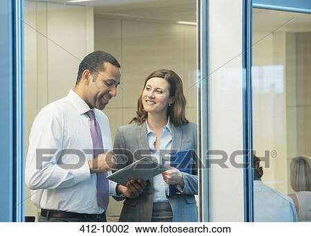Business people talking in meeting View Large Photo Image Stock Image - Business people talking in meeting. Fotosearch