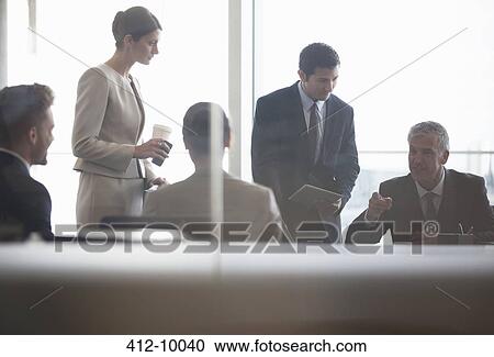 Business people talking in meeting View Large Photo Image Stock Image - Business people talking in meeting. Fotosearch
