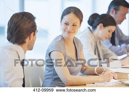 Stock Photo - Business people talking in meeting. Fotosearch