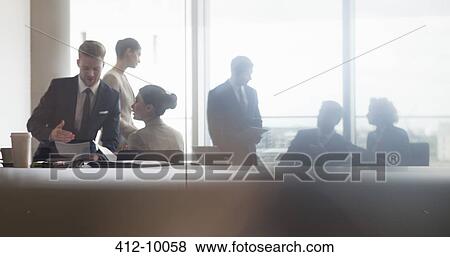 Business people talking in meeting View Large Photo Image Stock Photo - Business people talking in meeting. Fotosearch