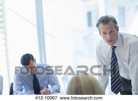Business people talking in meeting View Large Photo Image Stock Photo - Business people talking in meeting. Fotosearch