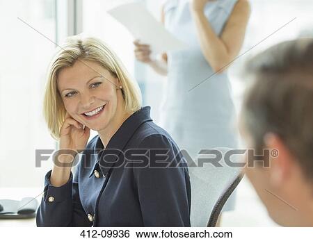 Business people talking in meeting View Large Photo Image Stock Photograph - Business people talking in meeting. Fotosearch
