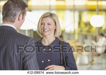 Business people talking in office View Large Photo Image Picture - Business people talking in office. Fotosearch