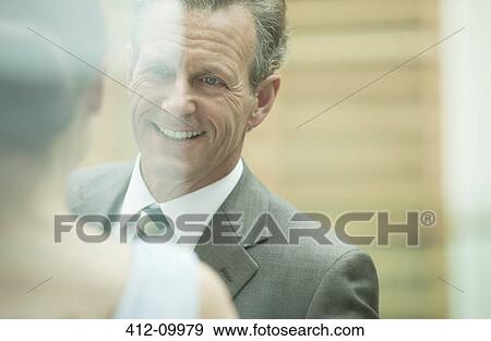Business people talking in office View Large Photo Image Stock Photo - Business people talking in office. Fotosearch