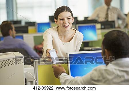 Business people using cell phone in office View Large Photo Image Stock Image - Business people using cell phone in office. Fotosearch